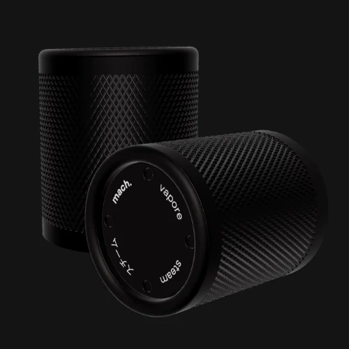 Two knurled black steam knobs, one showing its engraved face